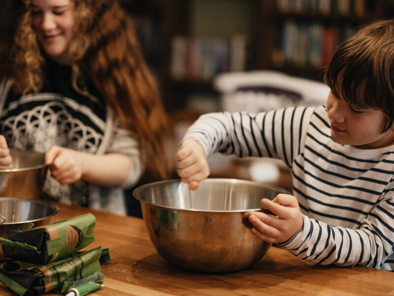Group of smiling children learning to cook at a kids cooking class in Melbourne